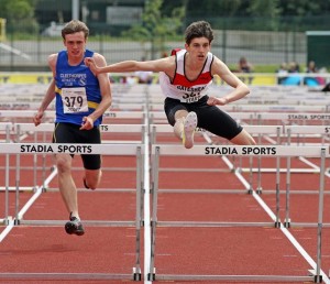 Jason Nicholson on route to winning the 100m hurdles after picking up the 400m hurdles title the previous day